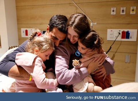 Man reunites with his wife and two young daughters, the three were captive by terrorists