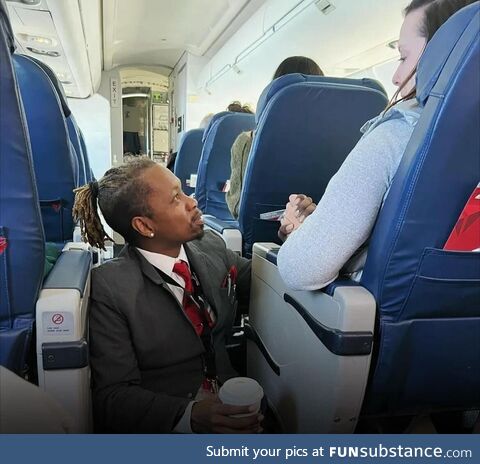 Flight attendant sits on the floor the entire flight to comfort distressed passenger