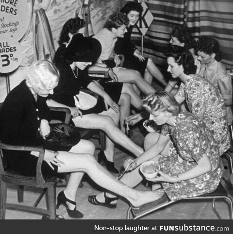 Women having stockings painted on instead of buying them during war time, 1941