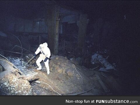 A lone scientist descending into the radioactive darkness of Chernobyl in 1986