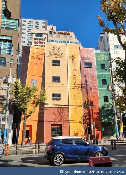 This book-shaped building in a street with lots of second-hand bookstores