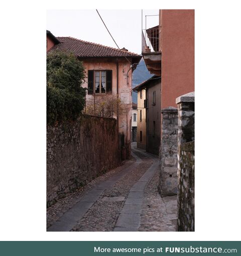 A cobblestone alley in lake como displaying rustic charm