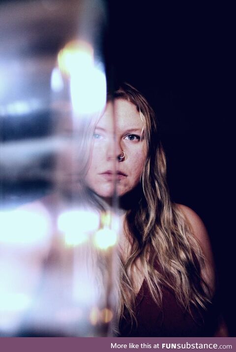 Self portrait using a window ledge and candle holder