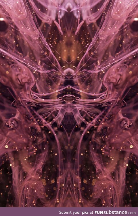 Water dyed pink, black ink with some gold glitter and mirrored