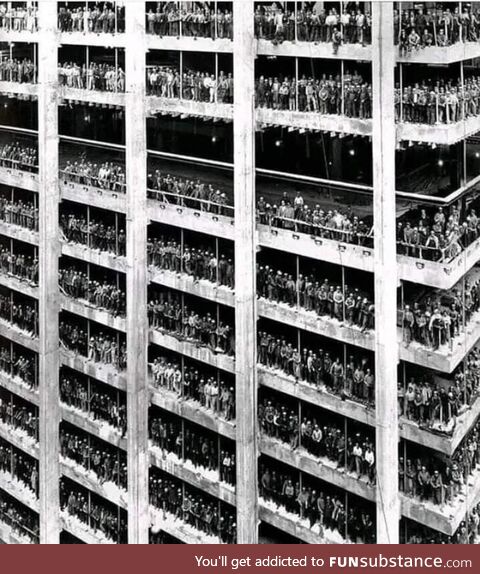 3000 men who constructed the Chase Manhattan Bank in NYC pose for a photo nearing its