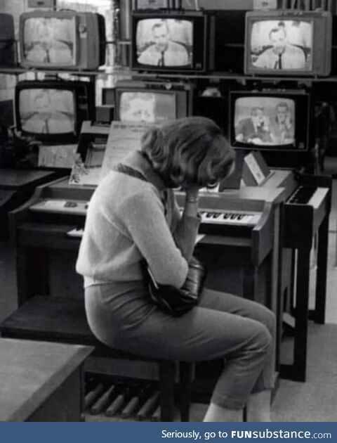 60 year old photo taken at a Sears Department Store as the news of JFKs assassination