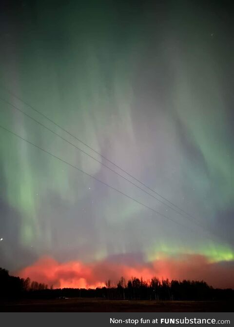 Wildfires in Alberta accompanied by Aurora Borealis