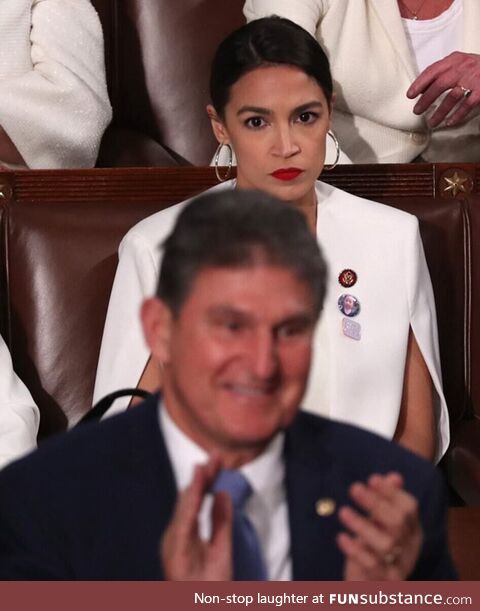 AOC looks at Senator Manchin