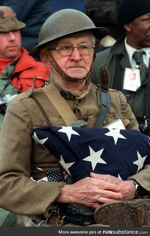WW1 vet Joseph Ambrose in his uniform and flag that draped his son Clement who died in
