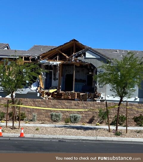 The townhouse down the street after SWAT used an excavator to attempt to apprehend their