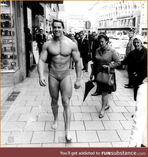 Arnold Schwarzenegger Walking Through Munich in Swimming Trunks in Order to Promote His