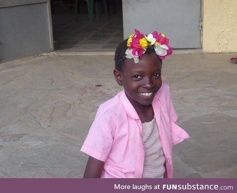A little girl I met in Kenya in 2016, wearing a fresh-picked flower crown that she made