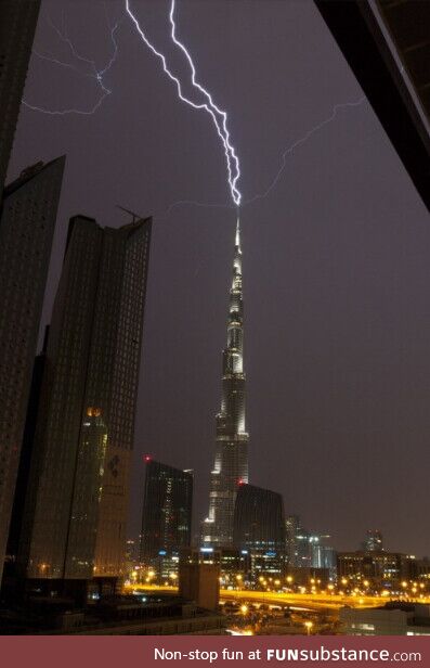 The tallest building in the world being struck by lightning