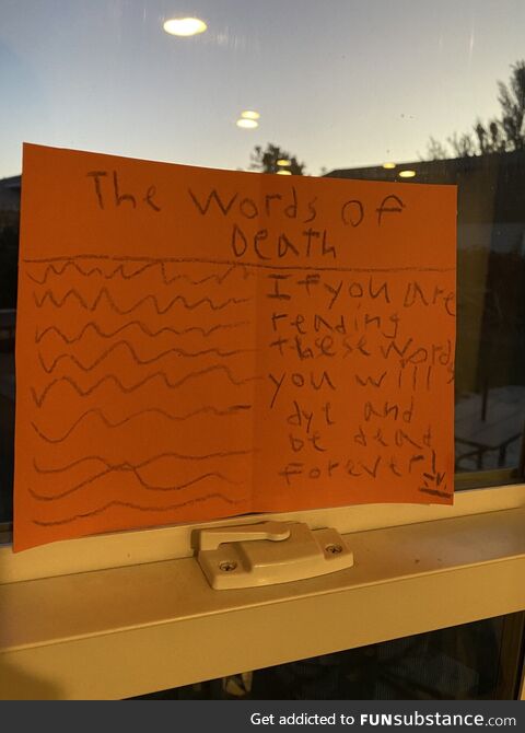 Our 8 year old made Halloween decorations this morning and we just noticed this one she