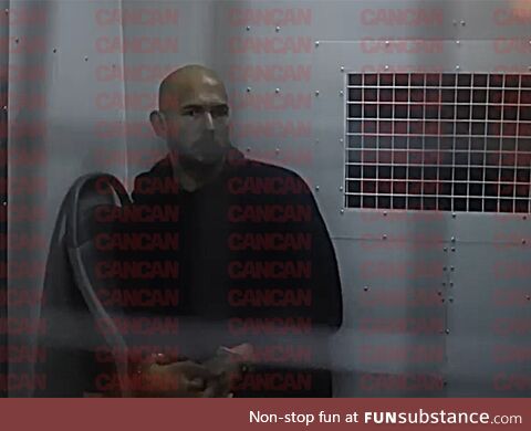 Andrew Tate handcuffed in prison van