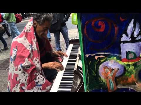 A homeless man saw this piano on the street and went to play it...