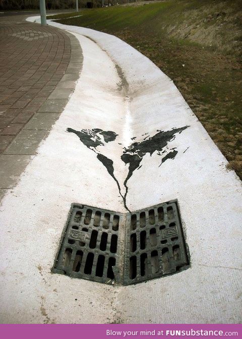 World going down the drain street art
